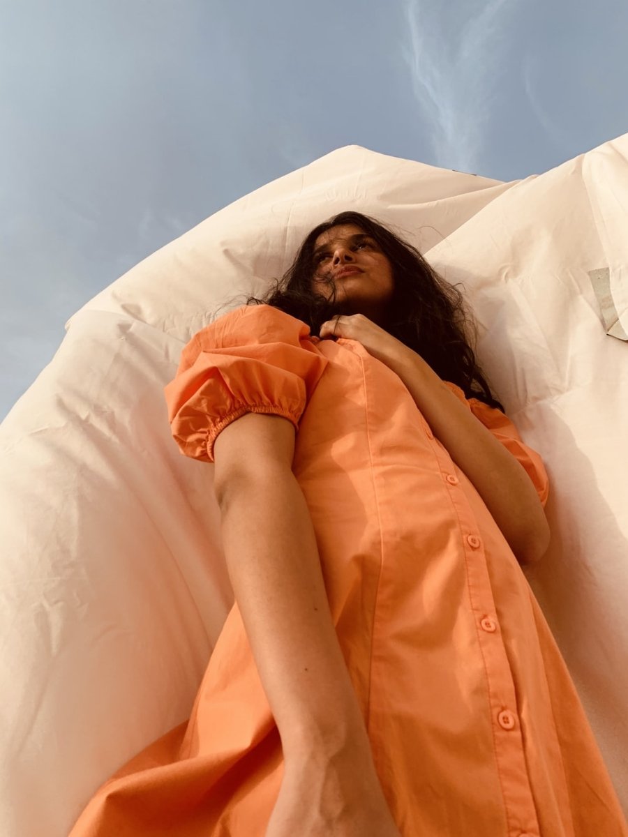 Paint By Numbers | Riyadh - Woman In Orange Dress Lying On Bed - Custom Paint By Numbers