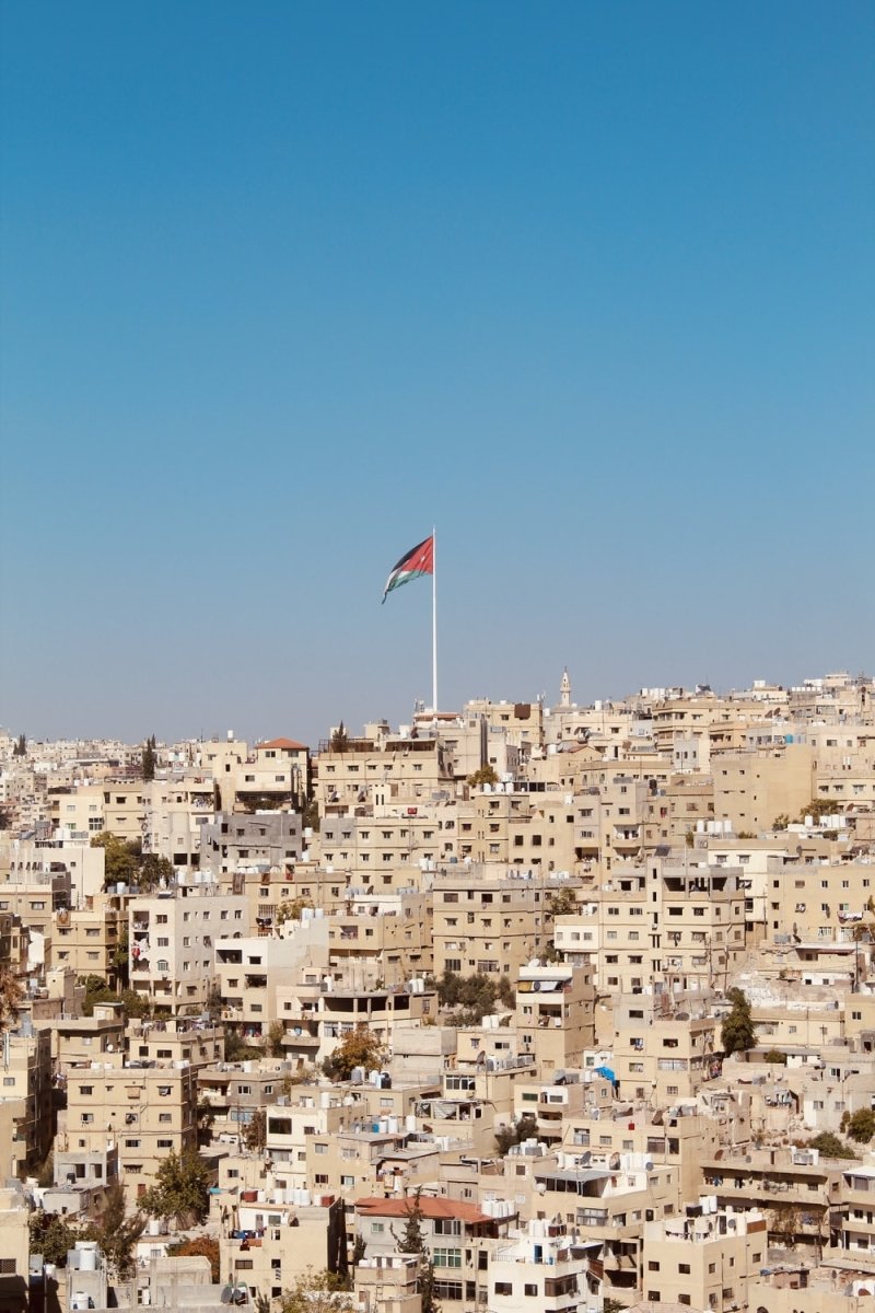 Paint By Numbers | Amman - Brown Houses With Red And Blue Flag Waving On Pole - Custom Paint By Numbers