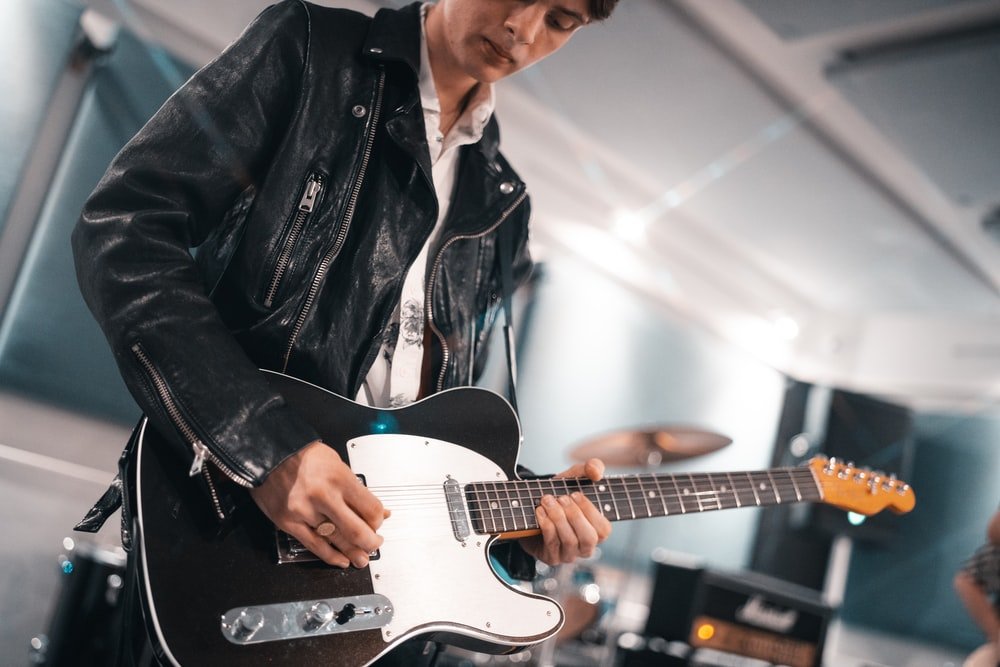 Paint By Numbers | Bass - Man In Black Leather Jacket Playing White Electric Guitar - Custom Paint By Numbers