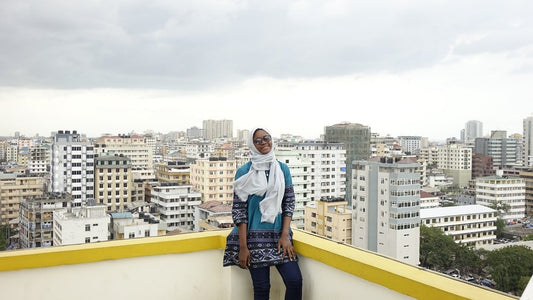 Paint By Numbers | Dar Es Salaam - Woman In White Long Sleeve Shirt And Blue Denim Jeans Standing On Yellow Concrete Wall During - Custom Paint By Numbers