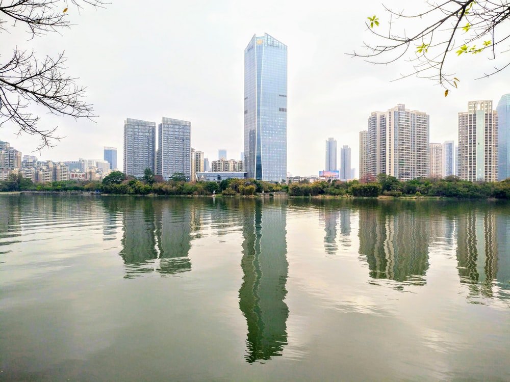 Paint By Numbers | Huizhou - Body Of Water Near City Buildings During Daytime - Custom Paint By Numbers