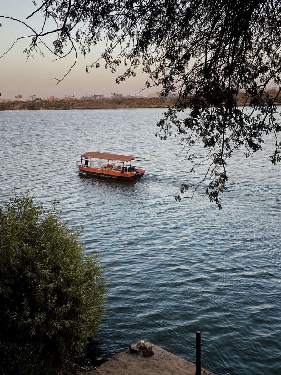 Paint By Numbers | Khartoum - Red Boat On Body Of Water During Daytime - Custom Paint By Numbers