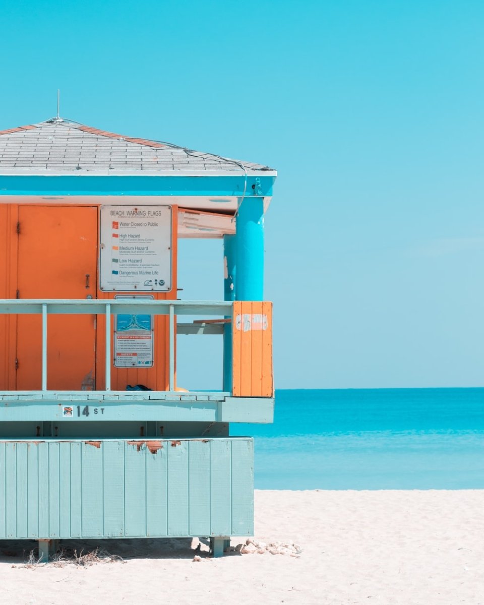 Paint By Numbers | Miami - Teal, Gray, And Orange House Near Seashore During Daytime - Custom Paint By Numbers
