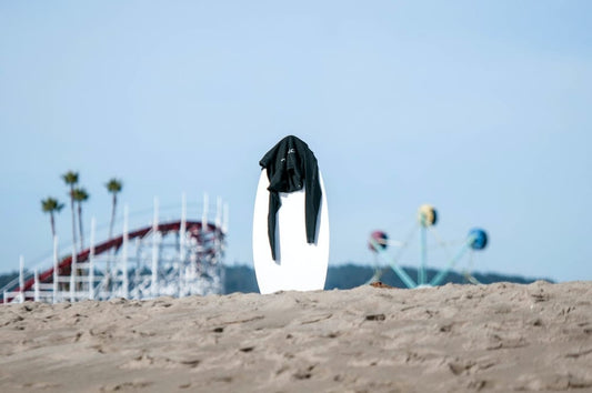 Paint By Numbers | Santa Cruz - White Surfboard With Black Rashguard On Top In The Middle Of Sand - Custom Paint By Numbers