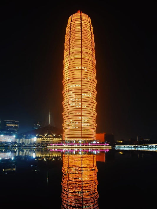 Paint By Numbers | Zhengzhou - Brown High Rise Building Near Body Of Water During Night Time - Custom Paint By Numbers